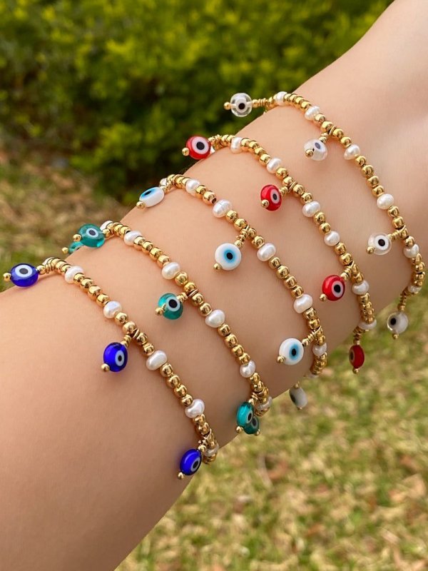 PULSERAS DE OJO Y PERLA NICOLE PUREST