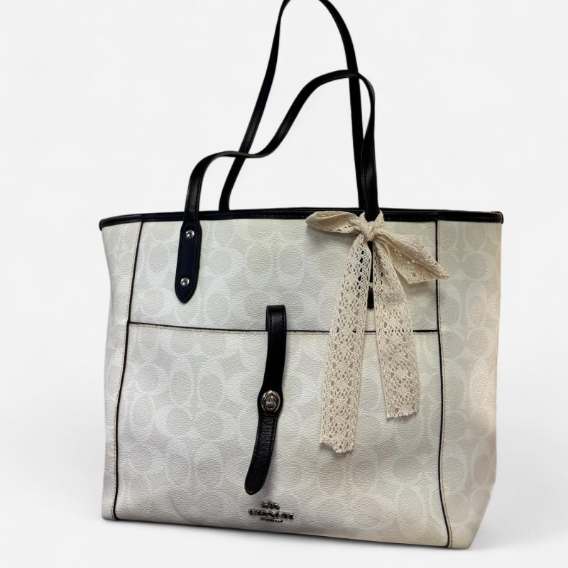CARTERA COACH BEICH Y NEGRO